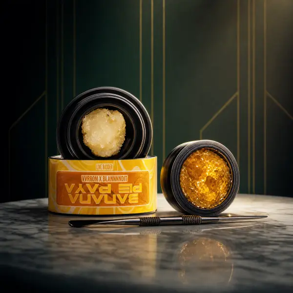 Concentrates: Live Badder in open jars with dab tool on marble